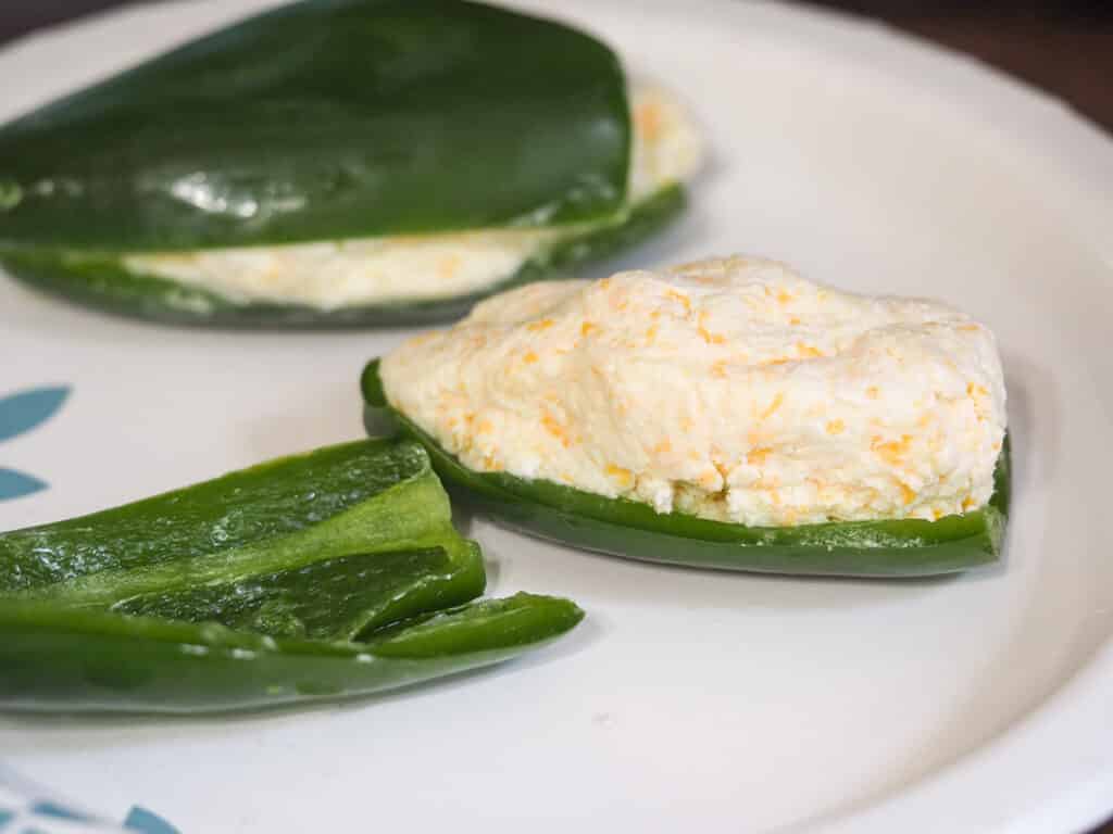 jalapenos stuffed with cream cheese on plate