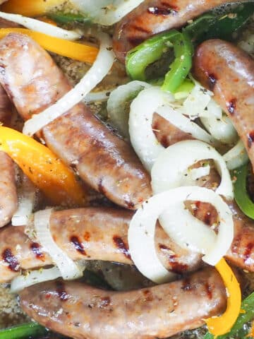 italian sausages in beer bath with green peppers and onions