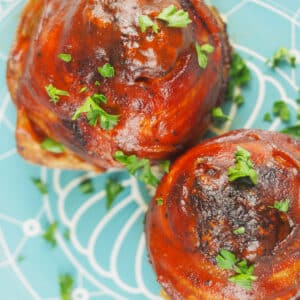 onion bombs overhead on blue plate sprinkled with parsley