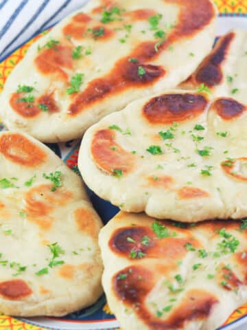 naan topped with fresh herbs