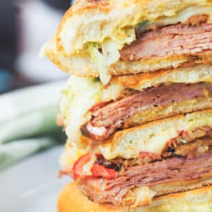 stacked sliced cuban sandwiches