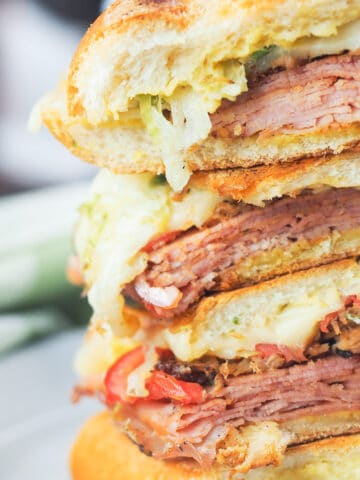 stacked sliced cuban sandwiches
